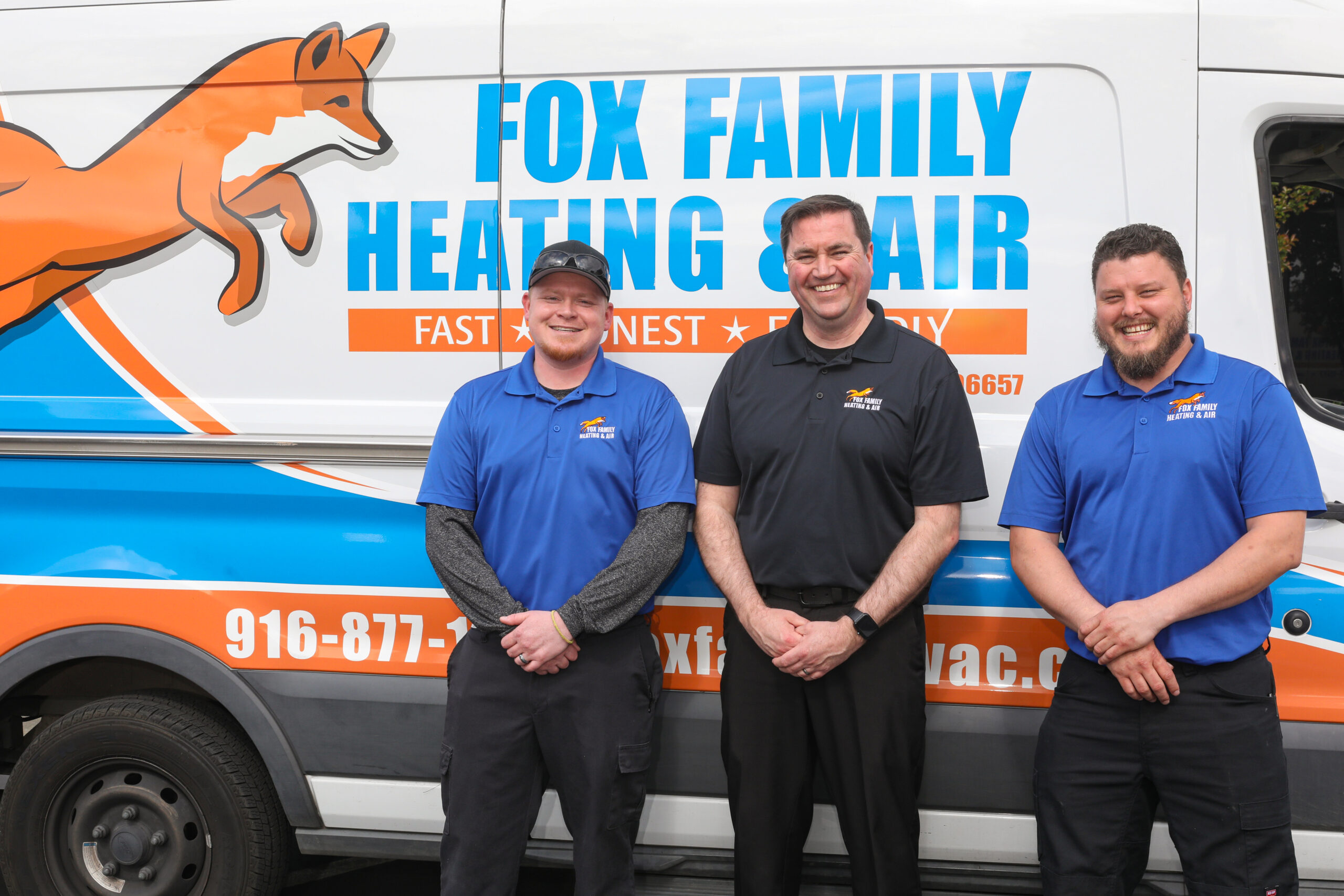 Fox Family Heating & Air Conditioning Team in Front of Service Van